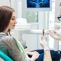 dentist explaining dental implants in Owings Mills to patient