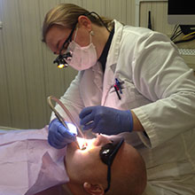 Dr. Mattson checking patients teeth