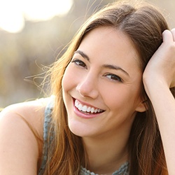 Woman smiling outside on a sunny day
