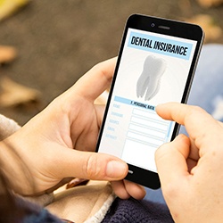 Looking at dental insurance form on a smartphone