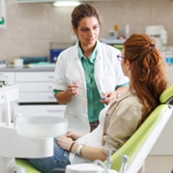 Patient and dentist talking in dental office