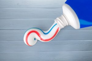 An open bottle of toothpaste.