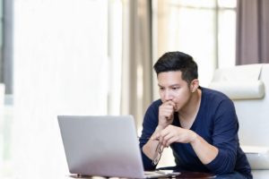 man researching on computer