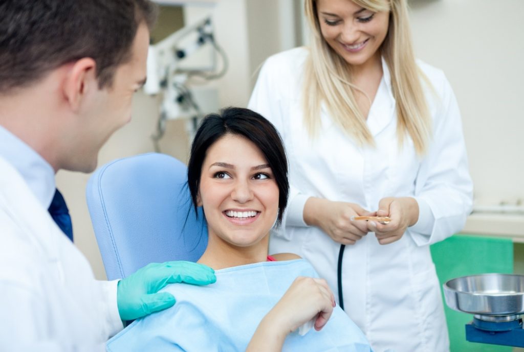 Dentist explaining the benefits of root canals to patient