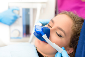 Female patient receiving nitrous oxide sedation via nasal mask