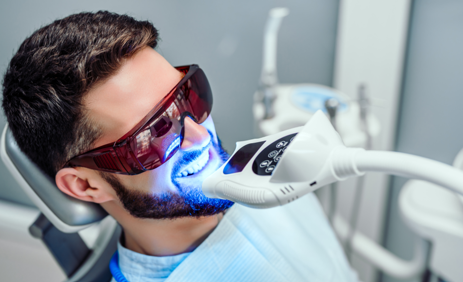 Man getting dental whitening treatment